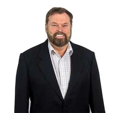 Bob Greska smiling wearing black blazer and plaid button down shirt - Greskas c60 carbon 60 supplement